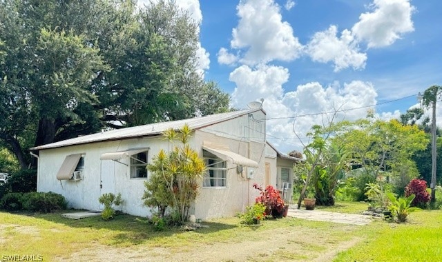 View of home's exterior with a lawn