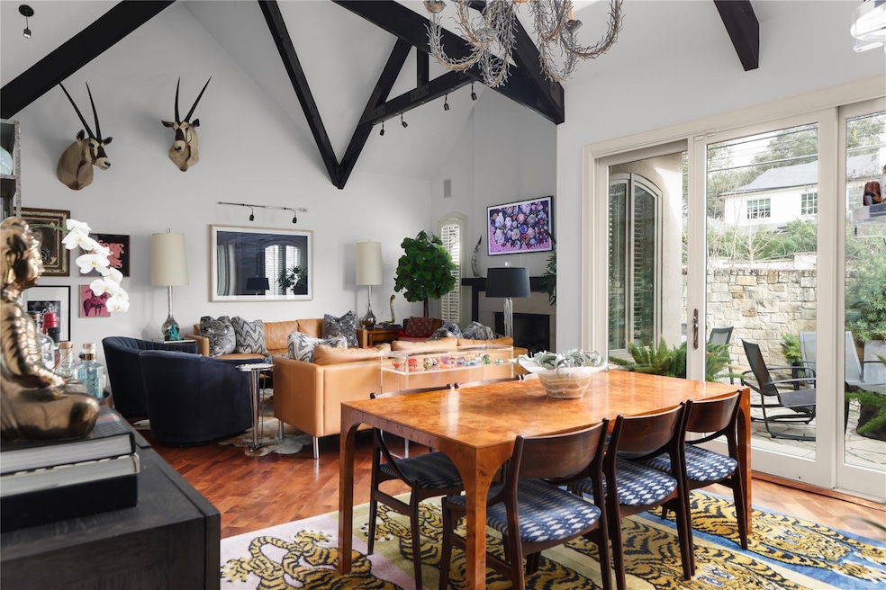 Dining space with high vaulted ceiling, beam ceil