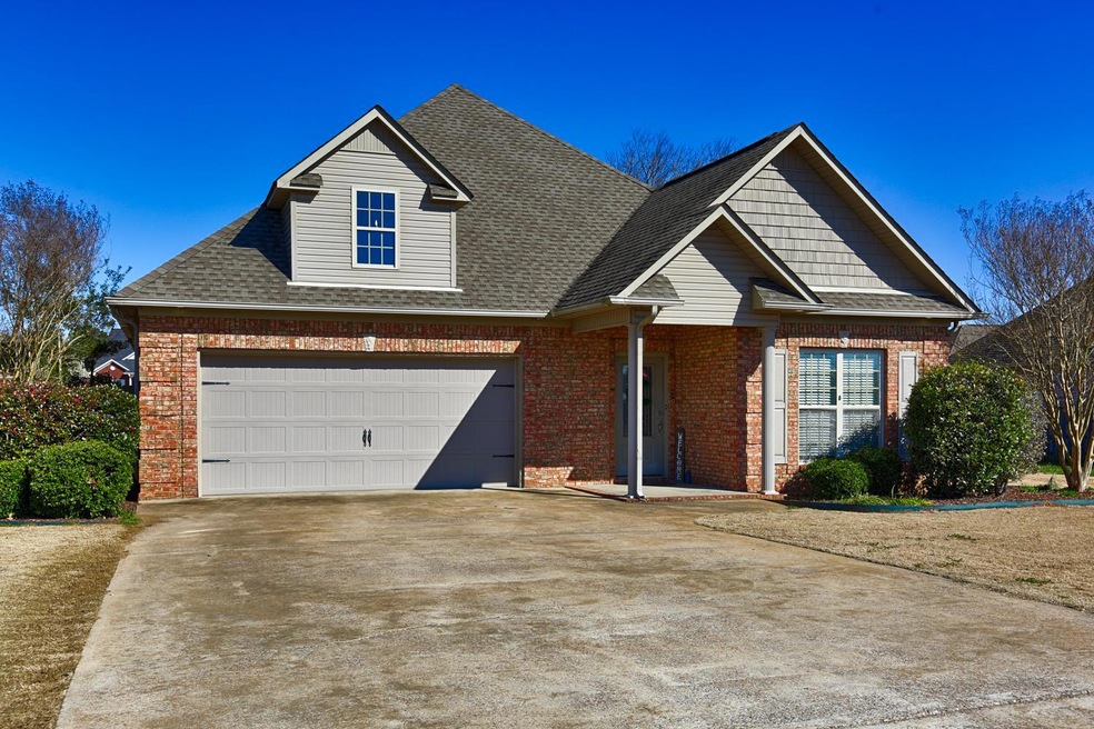 Front View of Home - Superb craftsmanship in this full brick home boasting 1923 square feet, 3 bedrooms and 2 full baths.  Exterior features include a concrete drive, attached garage, covered back porch, patio and privacy fenced back yard.
