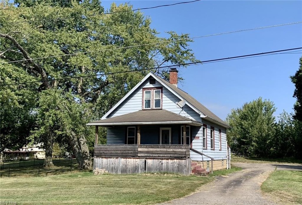 View of front of property with a front lawn and a 