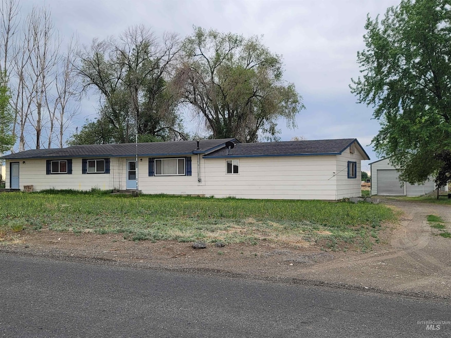 Single story home with an outbuilding