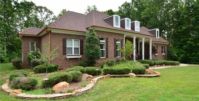 Acres of wooded privacy surround this fabulous cul