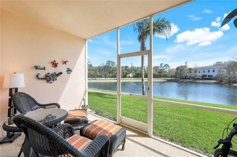 Sunroom / solarium featuring a water view