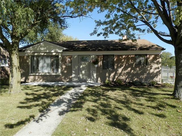 Front view, solid brick ranch with new porch.