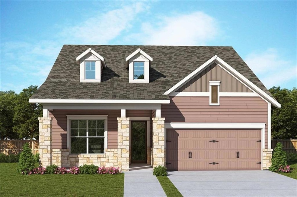 View of front of home with a front lawn and a gara