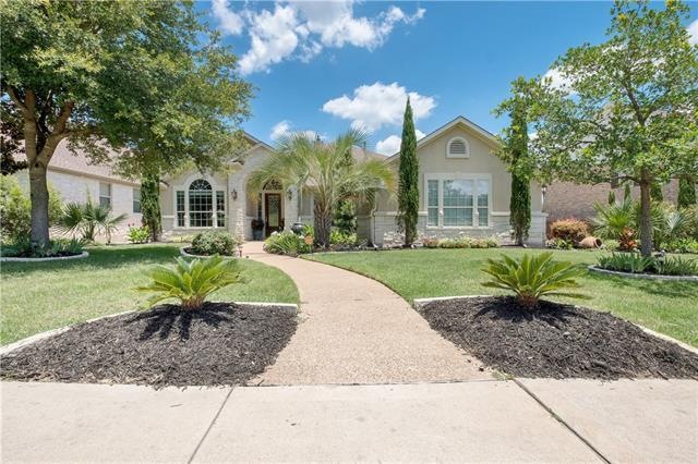 This amazing home has beautiful lush landscaping, 