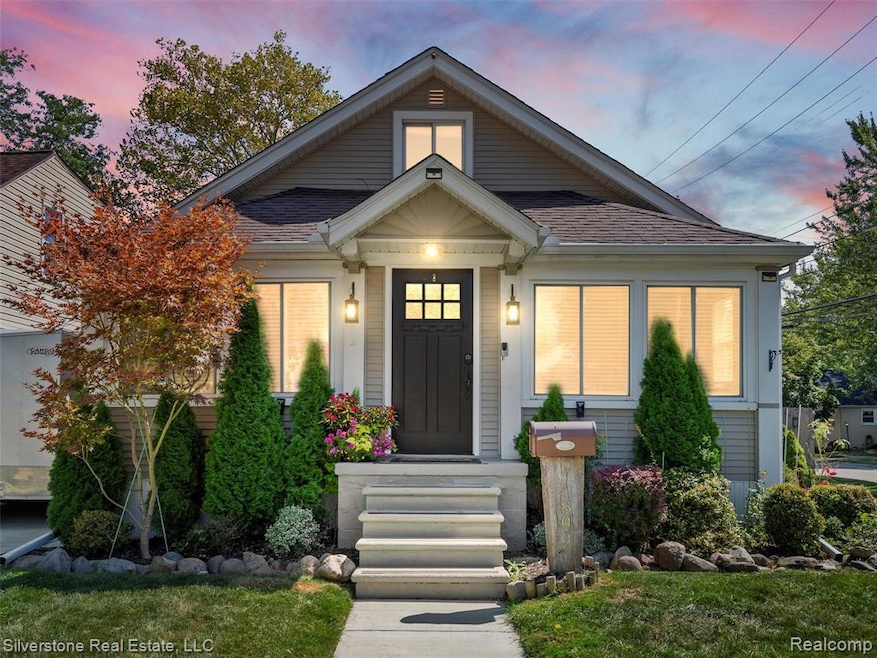 Bungalow-style home with roof with shingles