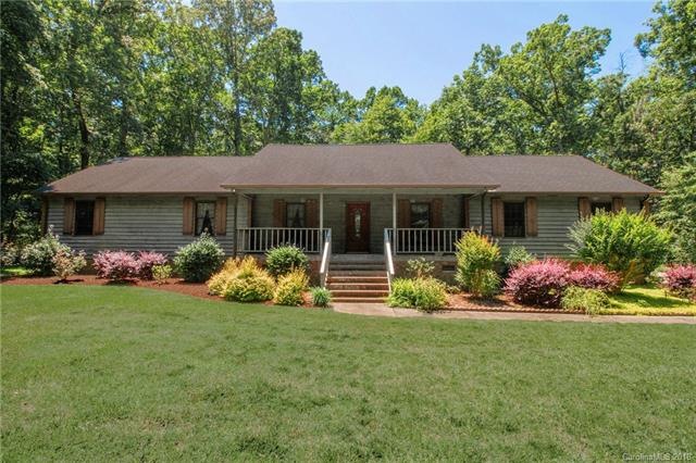 Rustic ranch sitting in beautiful wooded setting.
