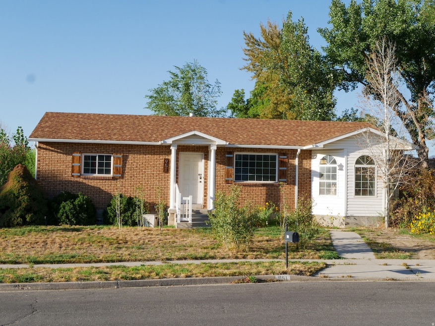 Ranch-style home with brick siding and a shingled roof