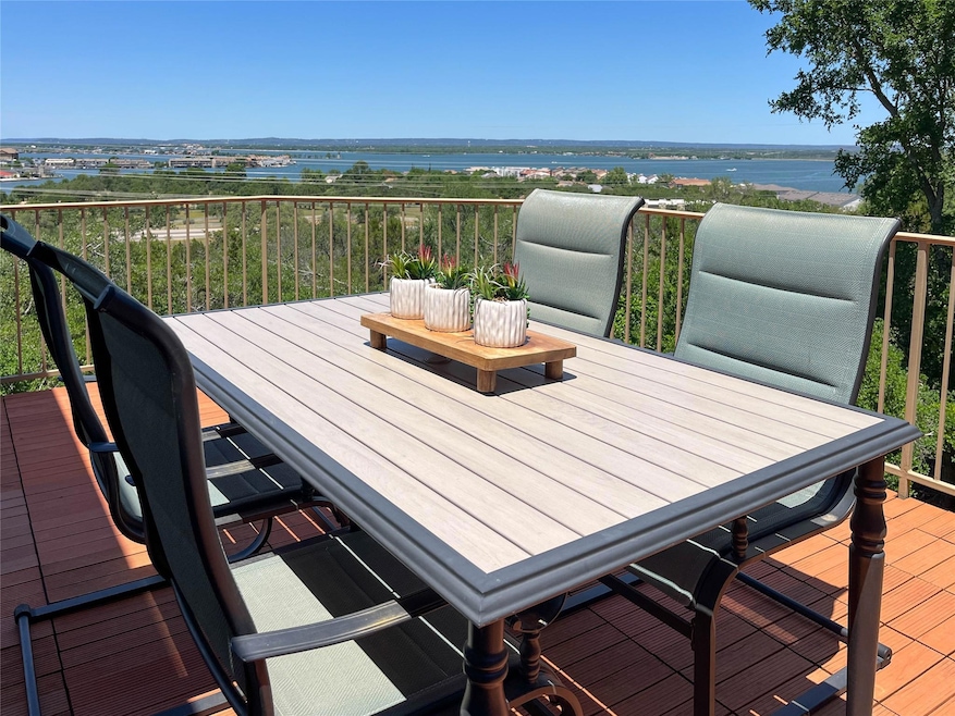 Wooden deck featuring a water view