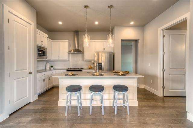 Stylish kitchen with large center island, stainles