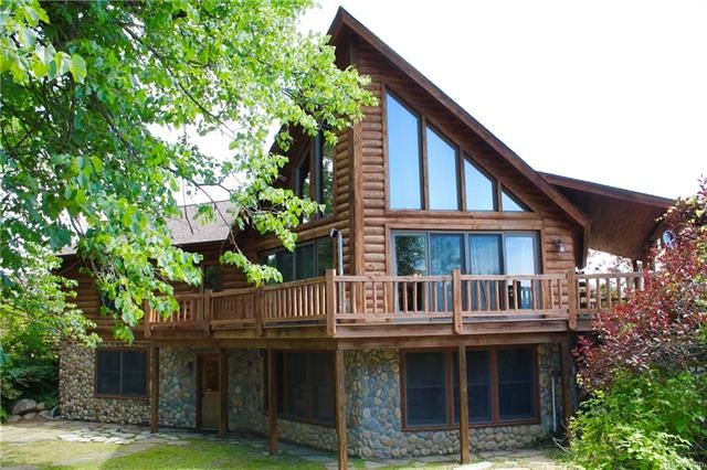 Back of home overlooking gorgeous wooded yard.