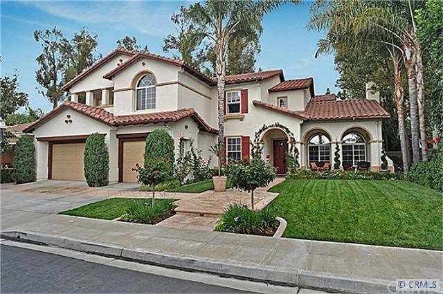 The warm exterior of the home exudes elegance!