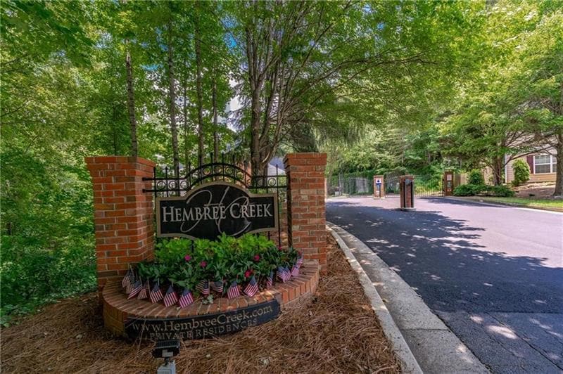 Beautiful gated entrance to quiet tree-lined stree