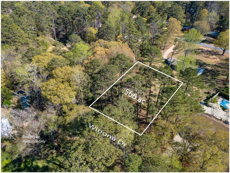 Aerial view featuring a forest view