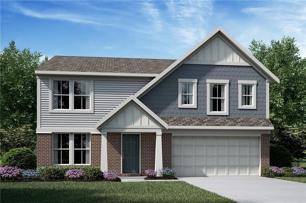 View of front of home with a front yard and a gara