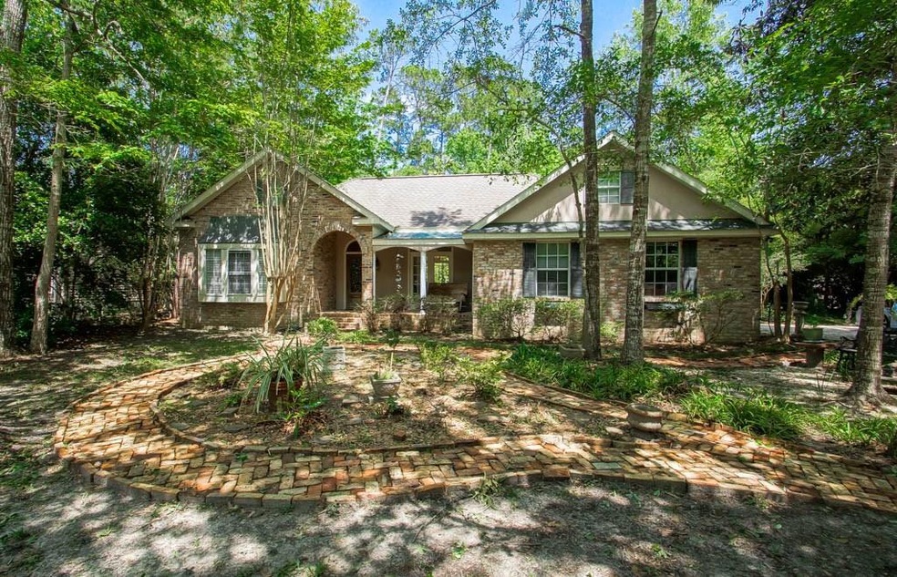 STUNNING ALL BRICK HOME IN A STORYBOOK SETTING AWA
