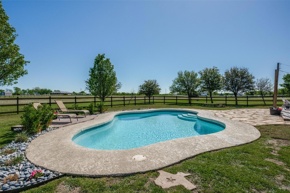 View of swimming pool with a yard and a patio area
