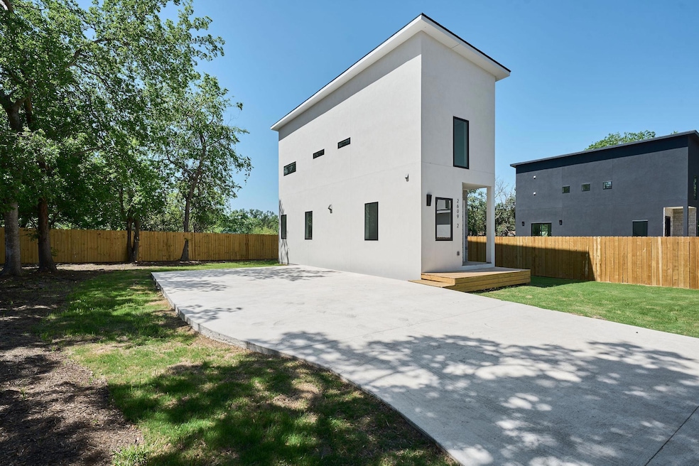 Back of house with a patio, a yard, stucco siding