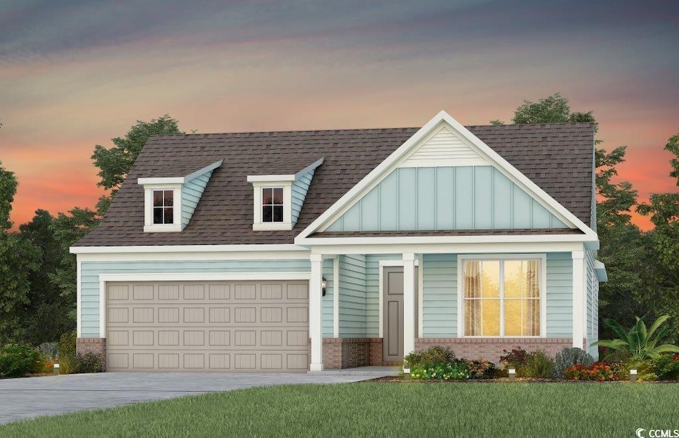 View of front of property featuring a shingled roof, concrete driveway, board and batten siding, and brick siding
