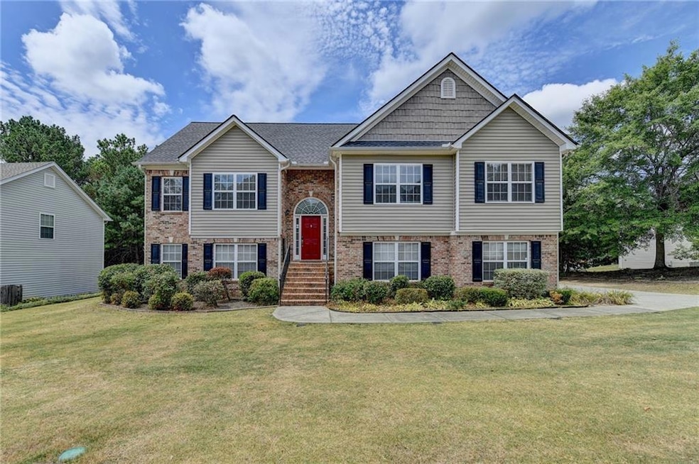Split foyer home with a front lawn