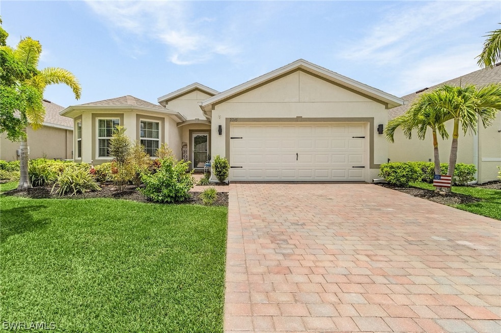 View of front of property featuring a garage and a