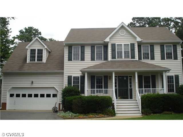 Exterior Front - Low maintenance vinyl siding with