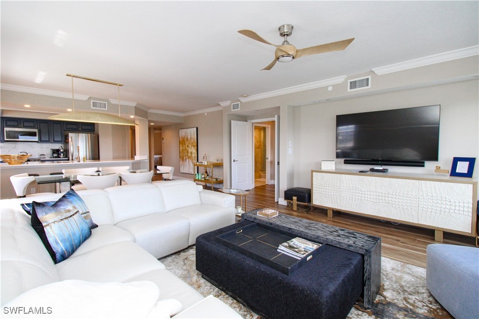 Living room with light hardwood / wood-style floor