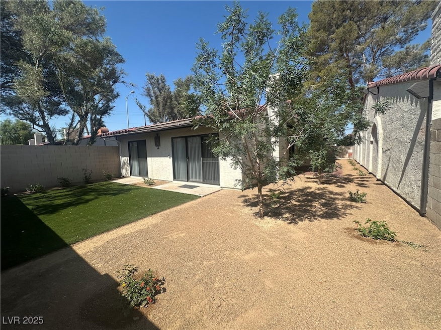 Rear view of property featuring stucco siding