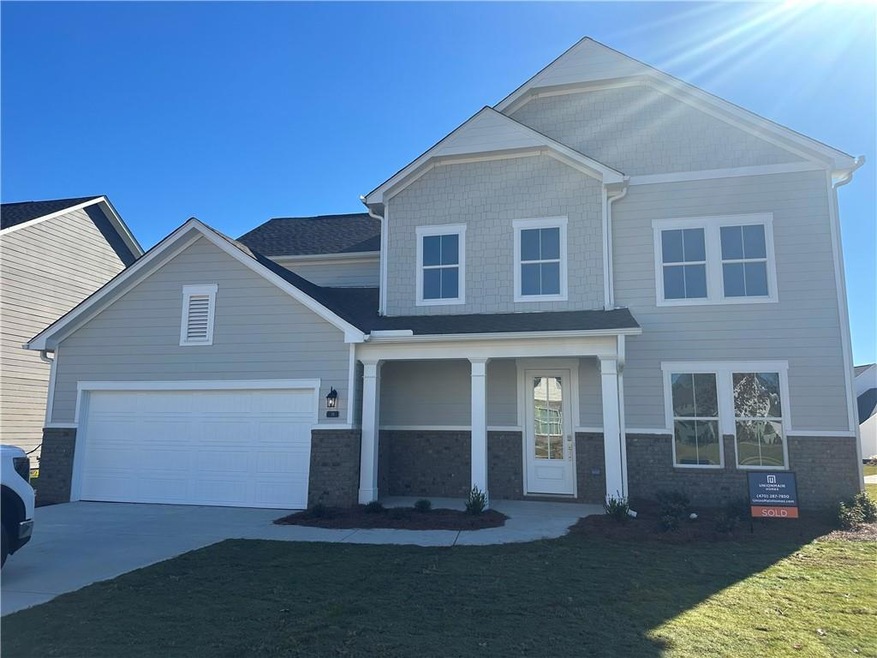 View of front of house featuring a front yard and 