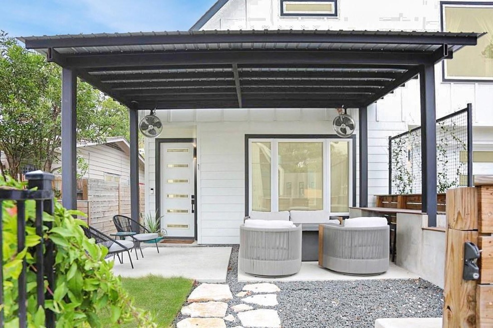 View of patio featuring fence