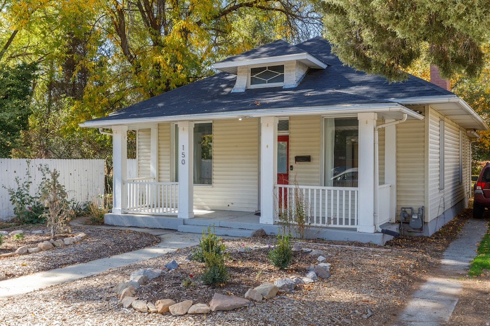 Bungalow-style home with a porch and roof with shingles