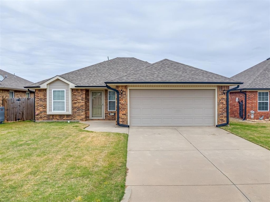 Single story home with a front yard, a shingled ro