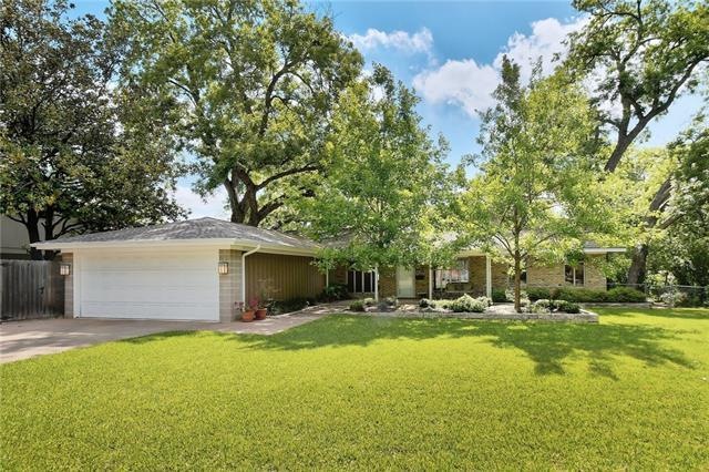 Large front yard this house has architectural flai