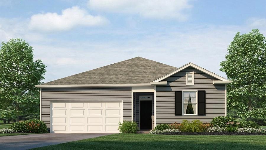 View of front of property with a front yard and a garage