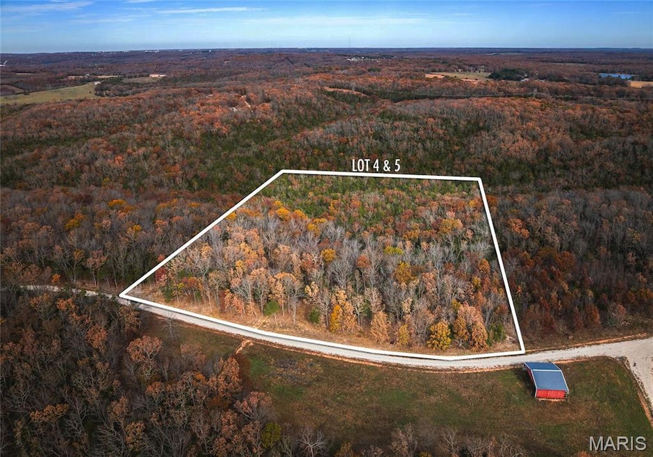 Aerial overview of property's location with property parcel outlined