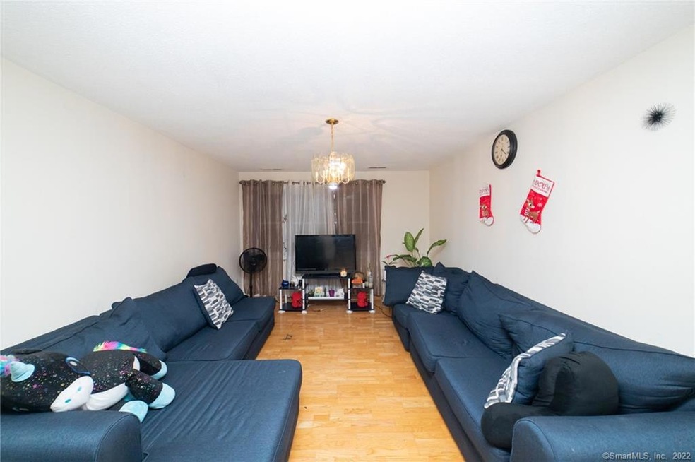 Large living room  with closet and a large window 