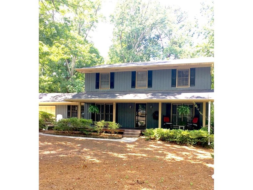Front view with large country Front Porch and open