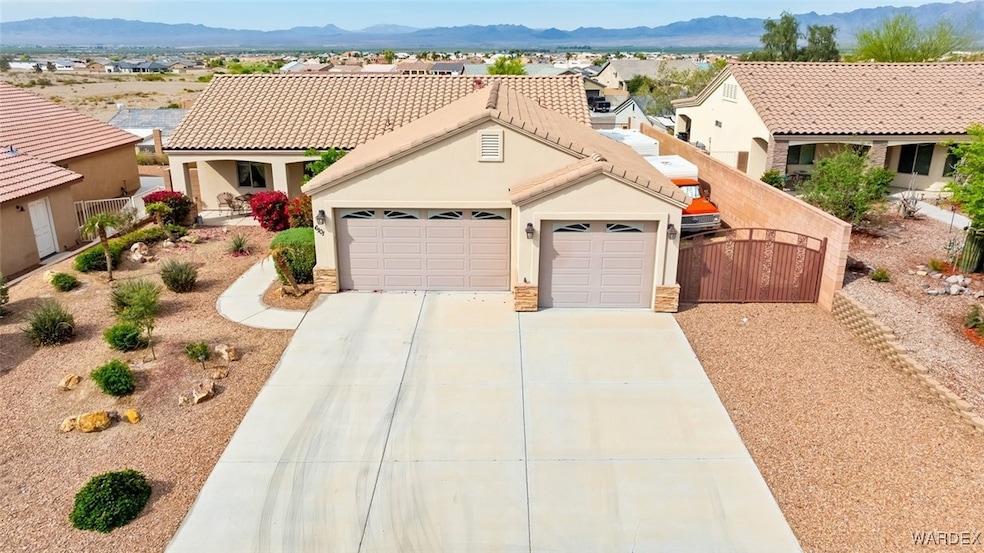 View of front of home with a tile roof, concrete d