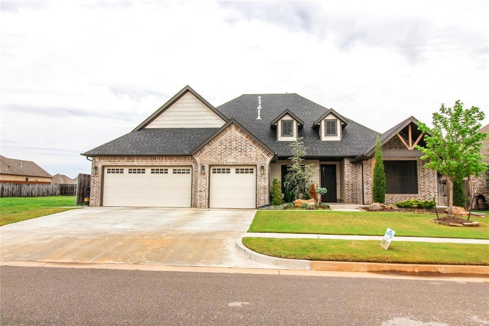 Craftsman house with an attached garage, brick sid