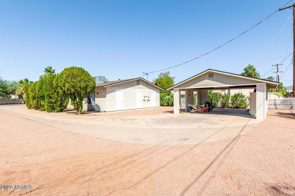 Back of home view and carport