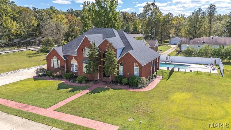View of front of home featuring brick siding