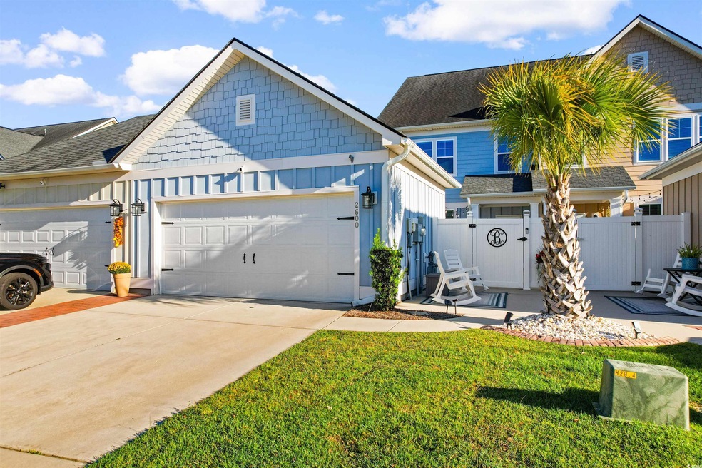 View of front of property featuring a garage and a