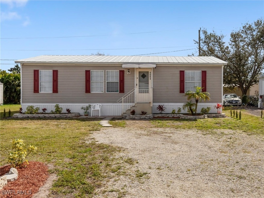 View of front of property with a front yard