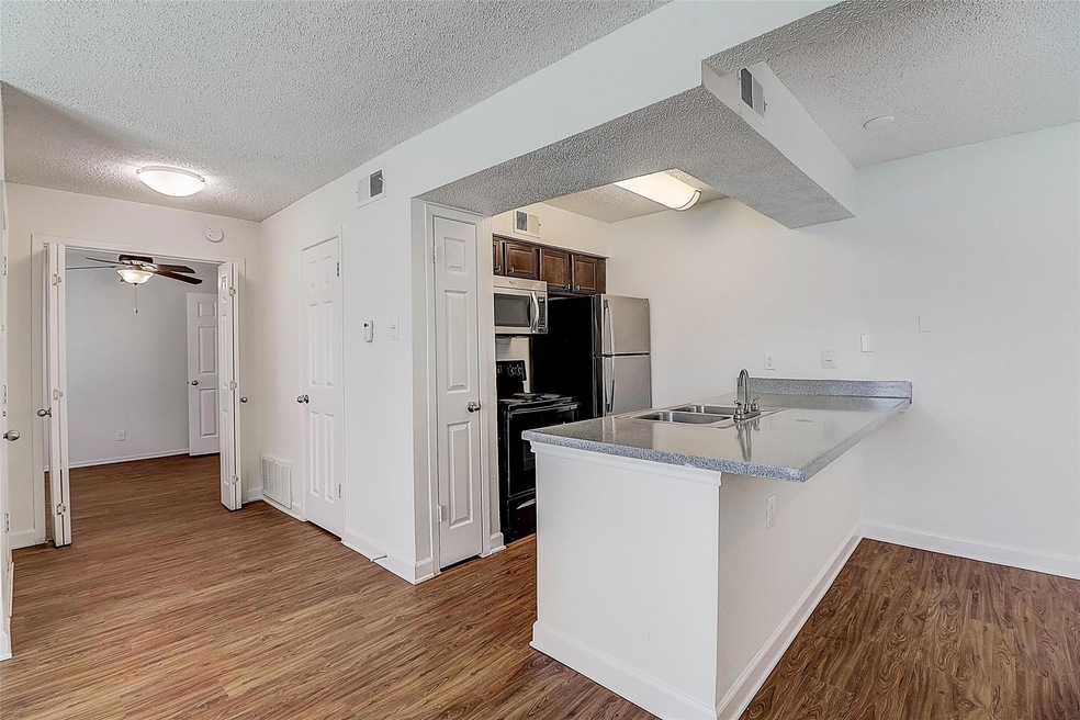 Kitchen featuring sink, light wood-type flooring, 