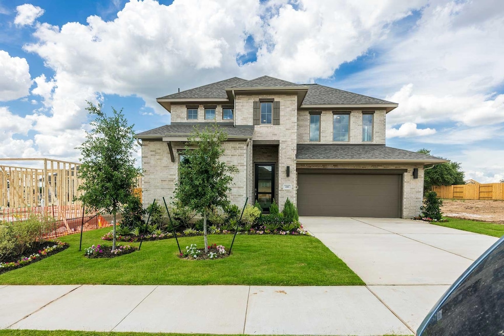 Prairie-style house with an attached garage, driv