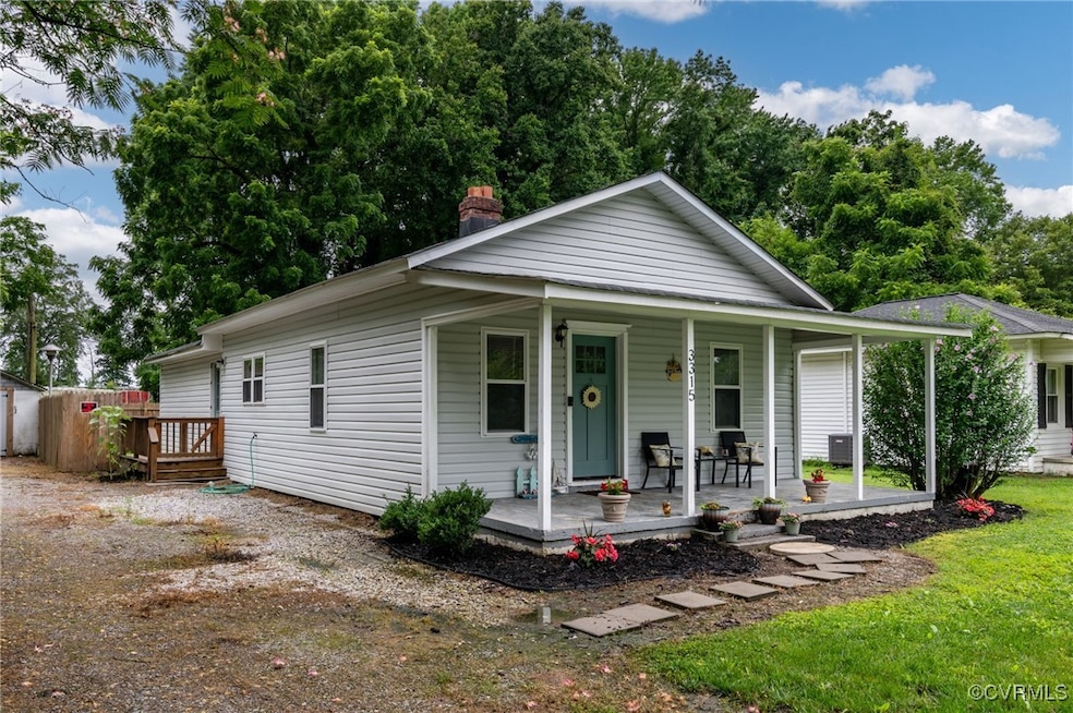 View of front of home featuring a porch, a chimney