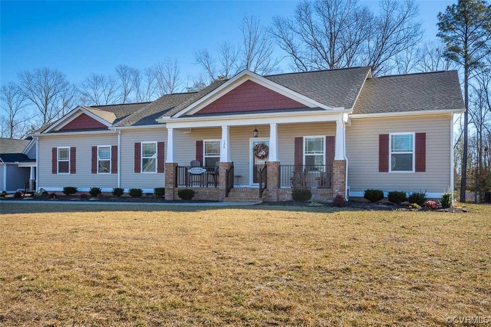 View of front facade with a porch and a front yard