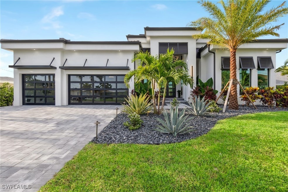 Contemporary home with stucco siding, an attached