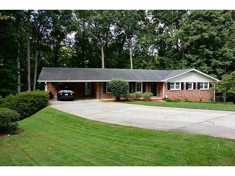 Exterior Front. Larger than it looks, 4 side brick
